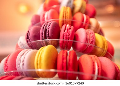 Colored Red Macaroon France Pastry Desserts On Store Counter.