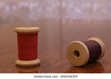 Colored sewing threads on the table.