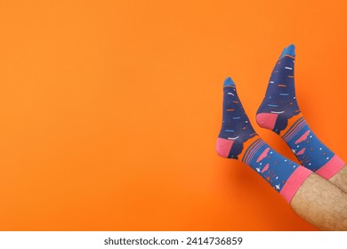 Colored socks with a print on men's feet. - Powered by Shutterstock