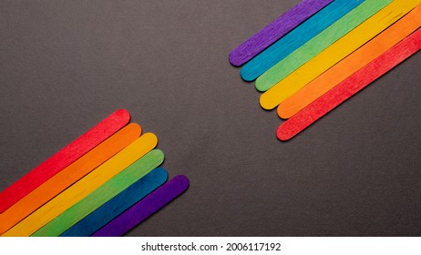 Colored Sticks Forming The Pride Flag With The Multicolored Rainbow On The Two Sides Of The Image On A Black Background