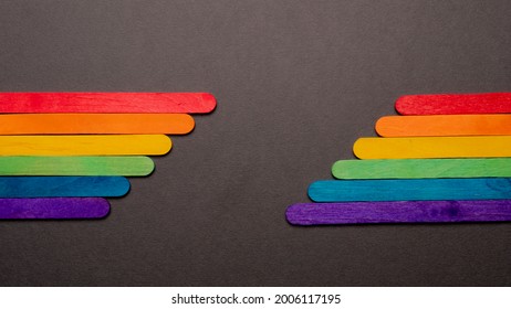 Colored Sticks Forming The Pride Flag With The Multicolored Rainbow On The Two Sides Of The Image On A Black Background