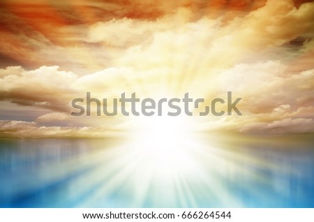 Colored Sunset. Sky with clouds and sun over blue sea