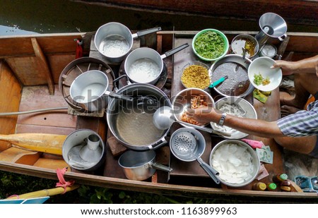 Colored thai food in floating market, food seller in Thailand, typical thai food background