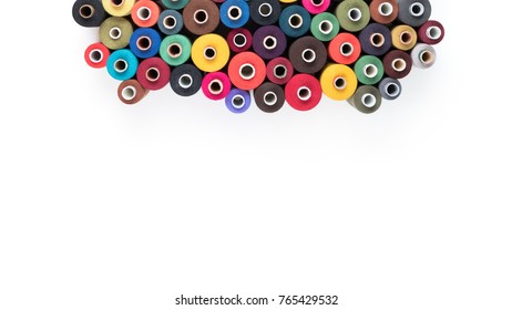 Colored thread coils isolated on white background, sewing supplies, text ready, banner, book or magazine cover