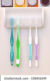 Colored Tooth Brushes In A Holder 