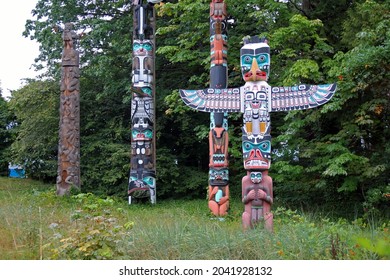 Colored and traditional totem poles in Stanley Park in Vancouver