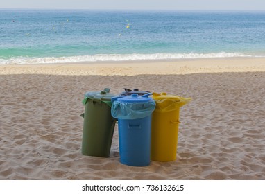 Colored trash cans at the beach - Powered by Shutterstock