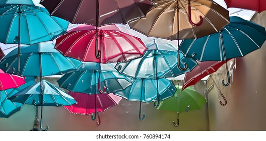 Colored umbrellas fly free