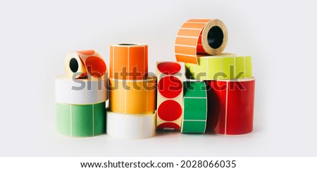 Colored and white reels with self-adhesive labels for printers