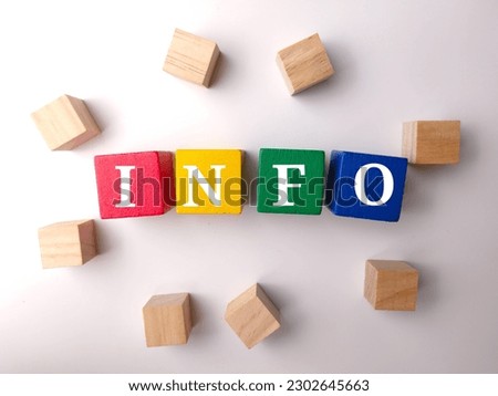 Colored wooden cube with the word INFO on white background