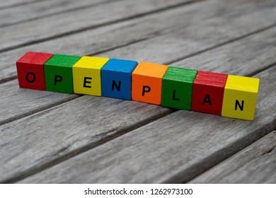 colored wooden cubes with letters. the word openplan is displayed, abstract illustration
