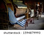 colored woolen threads on an old loom, Traditional Yarn in Canada.