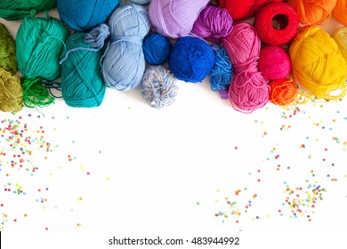 Colored yarn on a white background. Skeins of wool yarn for knitting. Colored confetti.