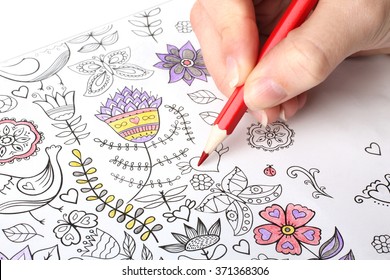 colorer - antistress with colored pencils.The woman draws thereby relieves stress - Powered by Shutterstock