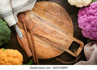 Colorfu Cauliflower. Cutting  Wooden Board And Various Sort Of Cauliflower On Old Wooden Background. Abstract Food Background. Purple, Yellow, White And Green Color Cabbages. Mock Up. Top View.