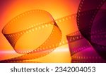 colorful abstract background with film strip.orange magenta background with film strip for background