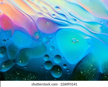 colorful abstract background with oil drops on water