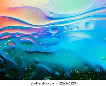 colorful abstract background with oil drops on water