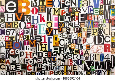 Colorful abstract collage from clippings with newspaper magazine letters and numbers. Alphabet letters cutting from paper magazine background.