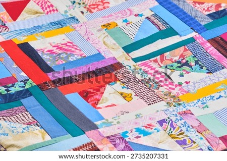 Colorful abstract patchwork background with diverse textile strips