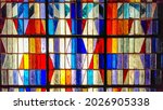 Colorful abstract stained glass background. Medieval random pieces of glass pattern with backlight