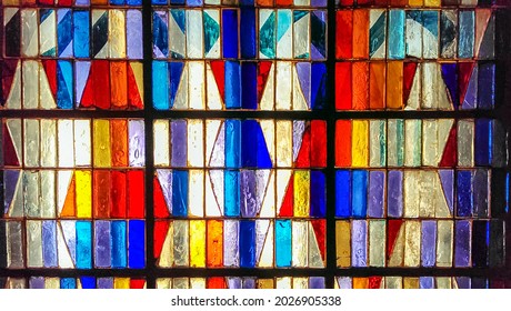 Colorful Abstract Stained Glass Background. Medieval Random Pieces Of Glass Pattern With Backlight