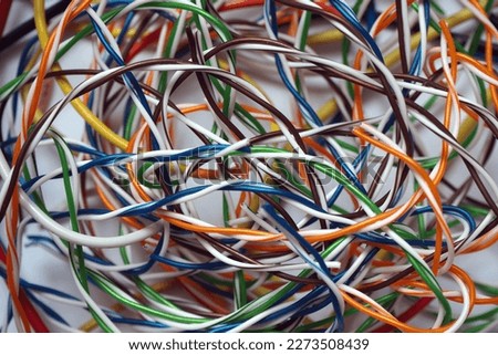 Colorful abstract wires texture. Chaotic cables on a white background.      