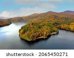 Colorful aerial view of Waterbury Reservoir near in Waterbury Vermont during the fall.