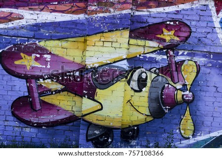 Colorful airplane on the wall