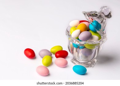 Colorful Almond Candies In The Stylish,crystal Candy Bowl On White With Copy Space.The Sugar Feast Concept. (Turkish Name; Ramadan - Ramazan Bayrami, Seker Bayrami)