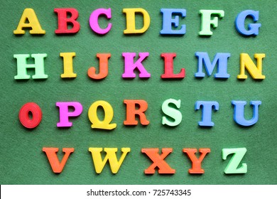 Colorful Alphabet Magnetic Letters On Green Background