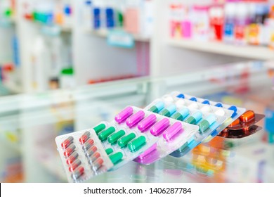 Colorful antibiotic capsule pills in blister pack. Antibiotic drug resistance. Blurry background medicine cabinet. antimicrobials capsule. pharmaceutical products