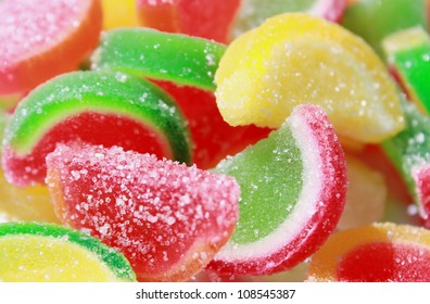 Colorful appetizing fruit candy close up, a background