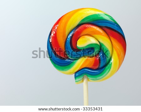 Colorful appetizing lollipop isolated on light gray background
