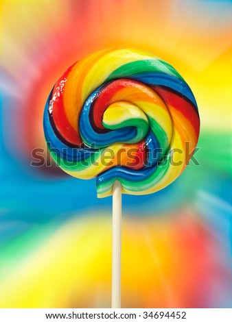 Colorful appetizing lollipop on colorful background isolated with clipping path