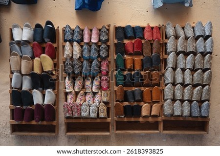 Colorful Arabic style sandals on racks in a medina in Morocco