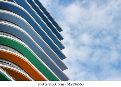 Colorful Architecture With Blue Cloudy Background.