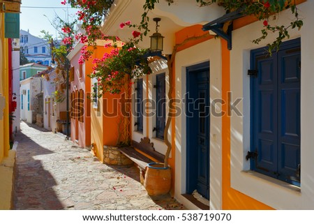 Colorful architecture in a street of Halki village, Greece.