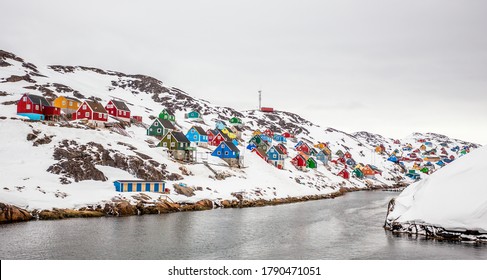 Colorful arctic village houses at the rocky fjord  in the middle of nowhere, Kangamiut, Greenland - Powered by Shutterstock