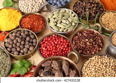 Colorful, aromatic spices in bowls on the table. - Shutterstock ID 427433128