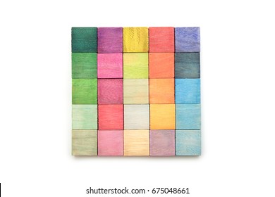 Colorful arrangement of wooden blocks arranged on a natural white background. flat lay or top view.