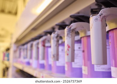 A colorful array of paint containers is ready to inspire creative projects in a professional setting