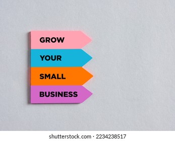 Colorful arrow shaped stickers with the message grow your small business. Business improvement, progress and growth concept. - Shutterstock ID 2234238517