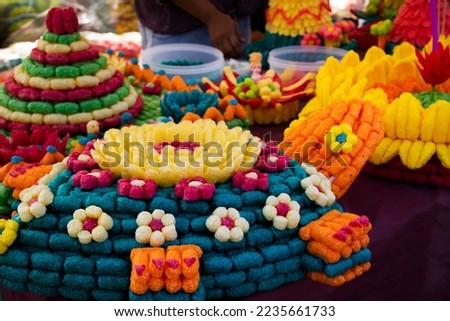 Colorful art handmade krathong or floating lantern basket craft for thai people into float at river for forgiveness from Goddess of water in Loy Krathong festival at Wat Sai Yai in Nonthaburi Thailand