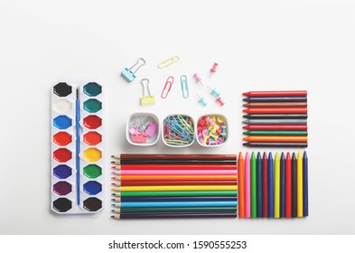 Colorful Art Supplies Organized On A White Background