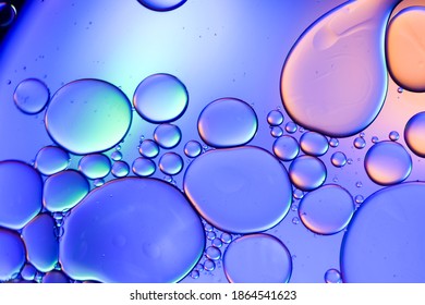 Colorful artistic of oil drop floating on the water.Fantastic structure of colorful oil bubbles.