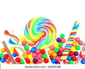 Colorful Assortment Of Candy Forming A Border Over White