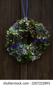 Colorful Autumn Flower Wreath With Hydrangea On A Wooden Door