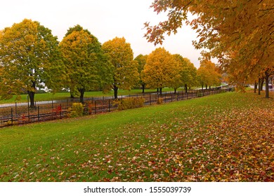 Colorful Autumn Landscape With Deciduous Trees In Burlington, Vermont, USA. Footpath Near Railroad On A Rainy Day In Fall Season.