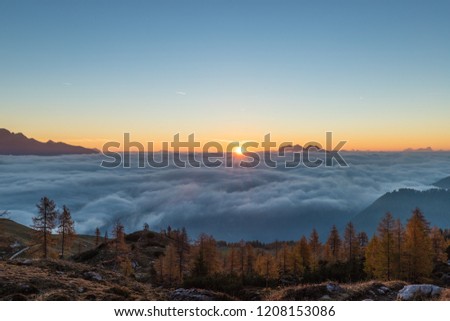 Colorful Autumn Sunrise Above The Clouds In The Lienz Dolmites Above Hochstadelhaus